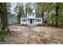 Charming white house with a covered porch and spacious yard at 925 Redgate Ave, Rocky Mount, NC 27801
