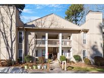 Condo building exterior, showing walkway, stairs, and landscaping at 514 New Kent Pl, Cary, NC 27511