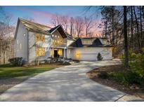 Stunning two-story modern home with a large driveway and beautiful architectural design at 811 Oxbow Crossing Rd, Chapel Hill, NC 27516