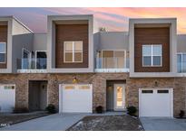 Modern three-unit townhome development with attached garages and private balconies at 4015 Southpoint Lndg Way, Durham, NC 27707