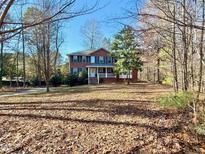 Brick two-story house with a large front yard and driveway at 430 Smith Level Rd, Chapel Hill, NC 27516
