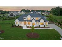 Stunning two-story home with a large, well-manicured front lawn at 1608 Legacy Ridge Ln, Wake Forest, NC 27587