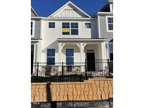 Charming exterior of newly constructed townhome featuring modern design elements and available signage at 496 Traditions Grande Blvd # 24, Wake Forest, NC 27587