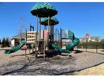 Community playground featuring slides, climbing structures, and safe play surfaces, perfect for Gathering enjoyment at 496 Traditions Grande Blvd # 24, Wake Forest, NC 27587
