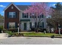Two-story brick home with a charming front yard and mature tree at 9201 Sayornis Ct, Raleigh, NC 27615