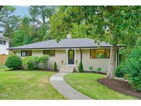 Brick Ranch home with landscaped yard and walkway at 1012 Norwood Ave, Durham, NC 27707
