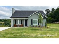 Charming one-story home with gray siding, covered porch, and well-manicured lawn at 244 Longbow Dr, Middlesex, NC 27557