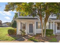 Two-story white house with gray shutters and a charming front porch at 3141 Rapid Falls Rd, Cary, NC 27519