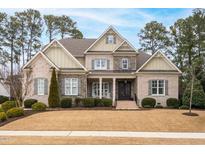 Brick two-story house with a large front yard and landscaping at 416 Calderbank Way, Cary, NC 27513