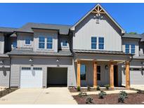 Charming home featuring a two car garage and inviting front porch with wood columns at 1031 Coldspring Circle, Durham, NC 27705