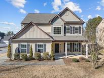 Two-story house with neutral siding and landscaping at 1425 Stone Wealth Dr, Knightdale, NC 27545