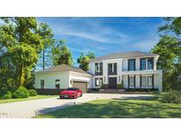 Stunning two-story home featuring a private driveway, black framed windows and a two-car garage at 180 Bur Oak Ct, Pittsboro, NC 27312