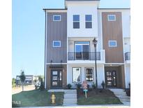 Modern two-story townhome with gray and white exterior at 2117 Treelight Way, Wendell, NC 27591