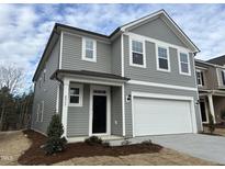 Two-story home with gray siding, white trim, and a two-car garage at 4937 S Trout Crest, Raleigh, NC 27604