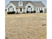 One-story house with a large front yard and attached garage at 59 Mar-Joy Dr, Dunn, NC 28334