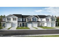 Front view of charming townhouses with attractive landscaping at 136 Parker Ln, Mebane, NC 27302