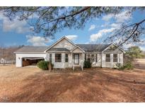 Ranch-style home with attached garage and spacious yard at 210 Alfalfa Ct, Smithfield, NC 27577