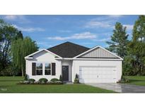 White house with gray accents, a two-car garage, and landscaping at 1133 Middlecrest Dr, Rocky Mount, NC 27804