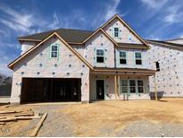New two-story home under construction features a spacious layout and attached two-car garage at 116 Black Walnut Dr # 203, Garner, NC 27529