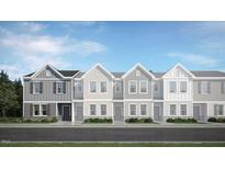 Three-story townhouses with gray and white siding at 1279 Willow Tree Way, Graham, NC 27253