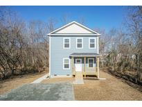Two-story house with blue siding, white trim, and a wooden porch at 343 Foster St, Burlington, NC 27217