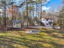 House with detached shed and firepit in wooded area at 497 Turn Key Way, Pittsboro, NC 27312