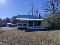 Newly renovated blue home with detached garage and large yard at 3612 Mt Zion Church Rd, Mebane, NC 27302