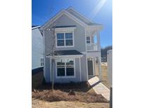 Charming two-story home with light gray siding, large windows, and a cozy front porch at 704 Georgia'S Landing Pkwy # 15, Raleigh, NC 27603