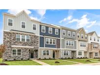 New townhome community with 3-story homes and attractive exterior finishes at 701 Lucky Clover Way, Fuquay Varina, NC 27526