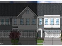 Two-story townhome with gray siding, white accents, and a two-car garage at 174 Nimble Way # 222, Clayton, NC 27520