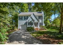 Charming two-story house with a gray exterior, landscaping, and driveway at 3001 Stanford Dr, Durham, NC 27707