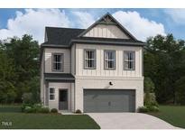 Two-story house with gray and beige siding, two-car garage, and landscaping at 4420 Darius Lane # 37, Fuquay Varina, NC 27526