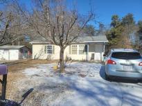 Ranch home with yard, driveway, and shed at 903 N Park Rd, Burlington, NC 27217