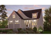 Two-story home with two car garage and front porch at 129 Windel Dr, Raleigh, NC 27609