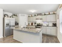 Modern kitchen with stainless steel appliances and granite countertops at 142 Teagarden Ct, Sanford, NC 27332