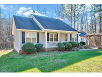 Charming one-story home with gray siding, front porch, and landscaped yard at 2120 Sterling Creek Ln, Franklinton, NC 27525