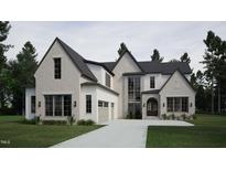 Two-story house with gray roof, white siding, and a three-car garage at 4112 Rockingham Dr, Raleigh, NC 27609