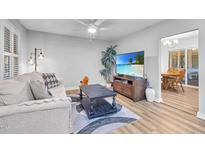 Comfortable living room featuring modern decor, stylish furnishings, and wood-look flooring at 1014 Holden Rd, Youngsville, NC 27596