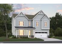 Two-story house with gray siding, white trim, and a two-car garage at 1105 Opal Ln # 70, Durham, NC 27705