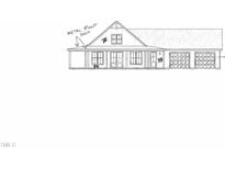 Two-story house with a metal roof, porch, and two-car garage at 216 Avery Rd, Erwin, NC 28339