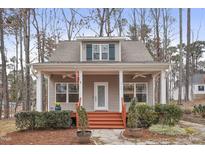 Charming craftsman style home with a front porch and well-manicured landscaping at 4716 Howe St, Durham, NC 27705