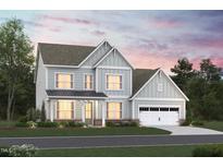 Two-story house with light gray siding, a metal roof, and a two-car garage at 1108 Opal Ln # 103, Durham, NC 27705