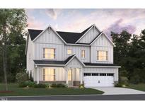 Two-story home with white siding, gray roof, and a two-car garage at 1113 Opal Ln # 72, Durham, NC 27705
