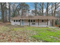 Charming ranch home with a covered porch and landscaped yard at 1302 Buffaloe Rd, Garner, NC 27529