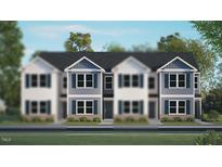 New three-unit townhome development with gray siding and white trim at 142 Holmes Corner Dr, Smithfield, NC 27577