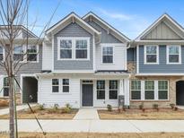 Two-story townhome with gray and white siding, and a gray front door at 310 Church St # 35, Wendell, NC 27591