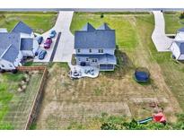 Spacious home with a backyard featuring an outdoor seating area, trampoline, and a swing set at 798 Christian Light Rd, Fuquay Varina, NC 27526