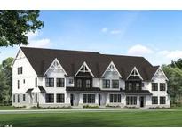 Three-unit townhome building with modern farmhouse style and a landscaped lawn at 917 Myers Point Dr # 21, Morrisville, NC 27560