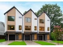 Three modern townhouses with attached garages and landscaped yards at 2123 Brewer St, Raleigh, NC 27608