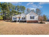 One-story house with brick accents and a spacious lawn at 808 Kinsman Ct, Raleigh, NC 27603